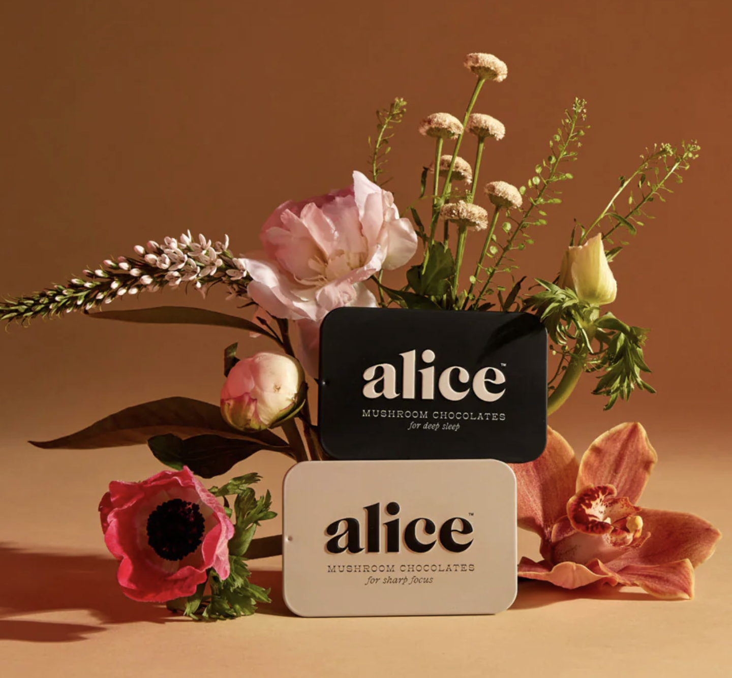 alice chocolate boxes on table with flowers